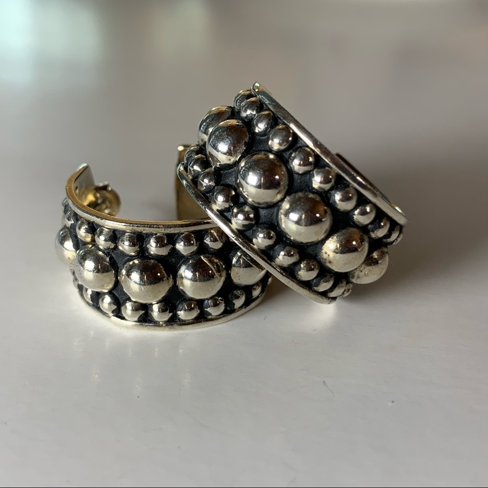 Moda Designs silver hoop earrings.